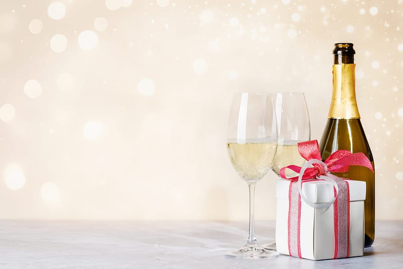 Magnus Champagne & accessories CHAMPAGNE ALWAYS A GOOD IDEA Champagne as a gift adds always an extra touch of elegance and thoughtfulness to the gift. They elevate the experience of enjoying this sparkling beverage, making it a truly special and memorable occasion for both the giver and the recipient. Our specialized champagne flutes & stoppers are designed to showcase the bubbles and maintain the wine’s effervescence. Every bottle of Champagne can be personalized to add an extra touch of exclusivity and shows that you have put thought and care into the gift. Ask our team now what you can do with your budget. What makes Champagne a beautiful and thoughtful gift: Elegance and Luxury: Champagne is associated with elegance, sophistication, and luxury. When you present a bottle of champagne as a gift, it instantly conveys a sense of celebration and indulgence, making the recipients feel valued and special. Symbol of Achievement: Champagne is often reserved for celebratory moments and milestones. By gifting it to your employees, you acknowledge their achievements, hard work, and dedication. It serves as a tangible symbol of recognition for their contributions to the company’s success. Memorable Celebrations: Champagne is synonymous with celebrations, such as anniversaries, promotions, or the successful completion of a project. Offering it as a gift adds to the joy of the occasion and creates lasting memories for the recipients. Versatility: Champagne is a versatile beverage that can be enjoyed in various settings. Whether it’s a formal corporate event, a casual team gathering, or a personal celebration, champagne fits well in all scenarios. Encourages Bonding: Sharing a bottle of champagne fosters camaraderie and encourages social bonding. It provides an opportunity for employees to relax, engage in conversations, and strengthen their relationships with each other and with the company. Boosts Morale: Receiving a champagne gift uplifts the spirits of employees and boosts their morale. It shows that their hard work is recognized and appreciated, motivating them to continue giving their best. Impressive Business Gift: When used as a business gift, champagne creates a positive impression on clients, partners, or potential investors. It portrays your company as thoughtful and considerate, leaving a lasting impression that may pave the way for future business opportunities. Thoughtful Personal Touch: Champagne gifts can be personalized by adding a special message, the recipient’s name, or a custom label. This personal touch enhances the gift’s significance and makes it even more meaningful to the receiver. Celebrating Milestones: Champagne is perfect for celebrating important business milestones, such as the launch of a new product, the signing of a significant deal, or the achievement of a major business goal. It adds a touch of festivity and joy to the occasion. Timeless and Classic: Champagne has been a symbol of celebration for centuries. By gifting it, you tap into a timeless tradition that transcends generations and cultures, making it a universally appreciated and cherished present. Giving champagne as a gift to employees or using it as a business gift is a gesture that exudes elegance, celebration, and appreciation. It creates a sense of joy and togetherness, making it a beautiful and meaningful choice for various occasions in both personal and professional settings. Magnus Business Gifts is your partner for merchandising, gadgets or unique business gifts to match your company, school or sports organisation.
